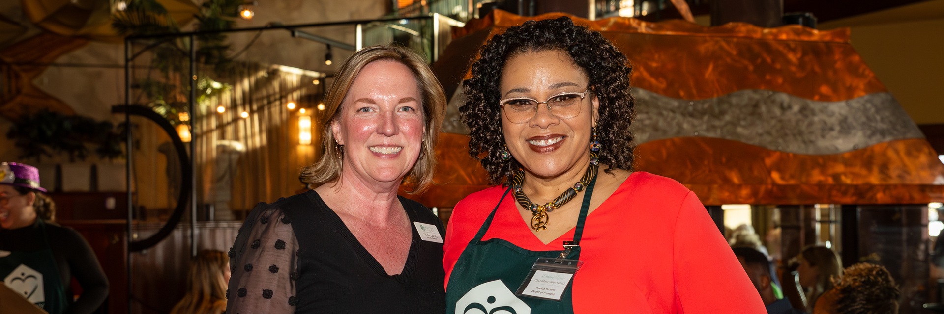 two women at a fundraising dinner