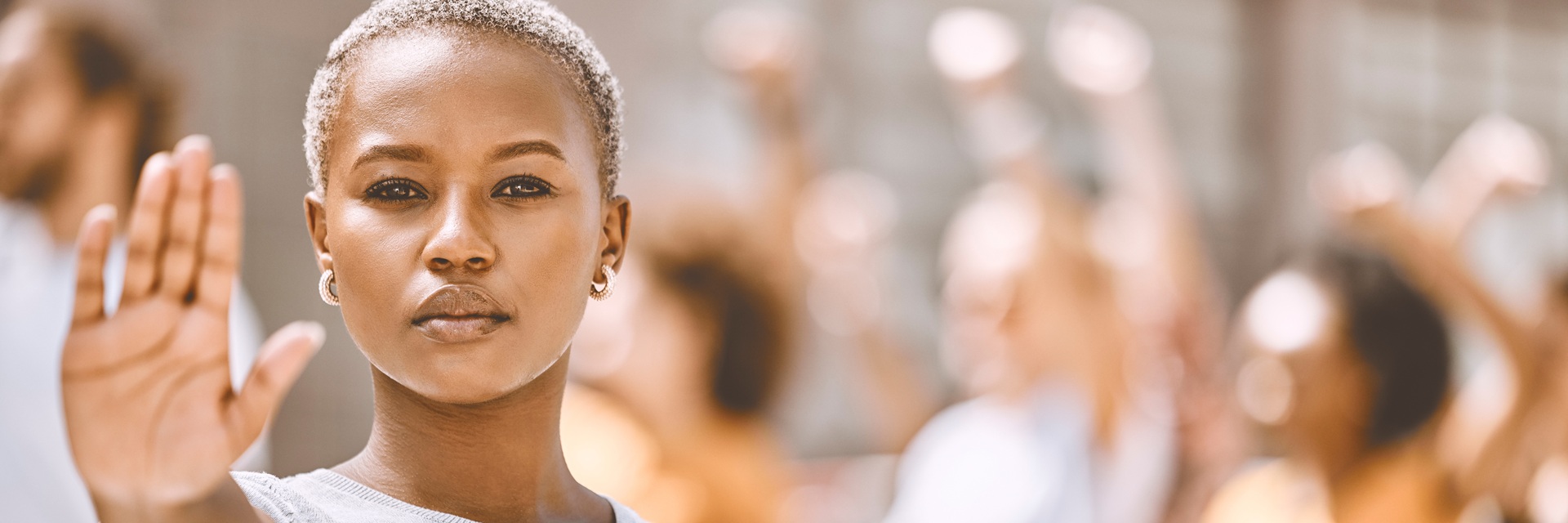 Black female holding up hand to stop
